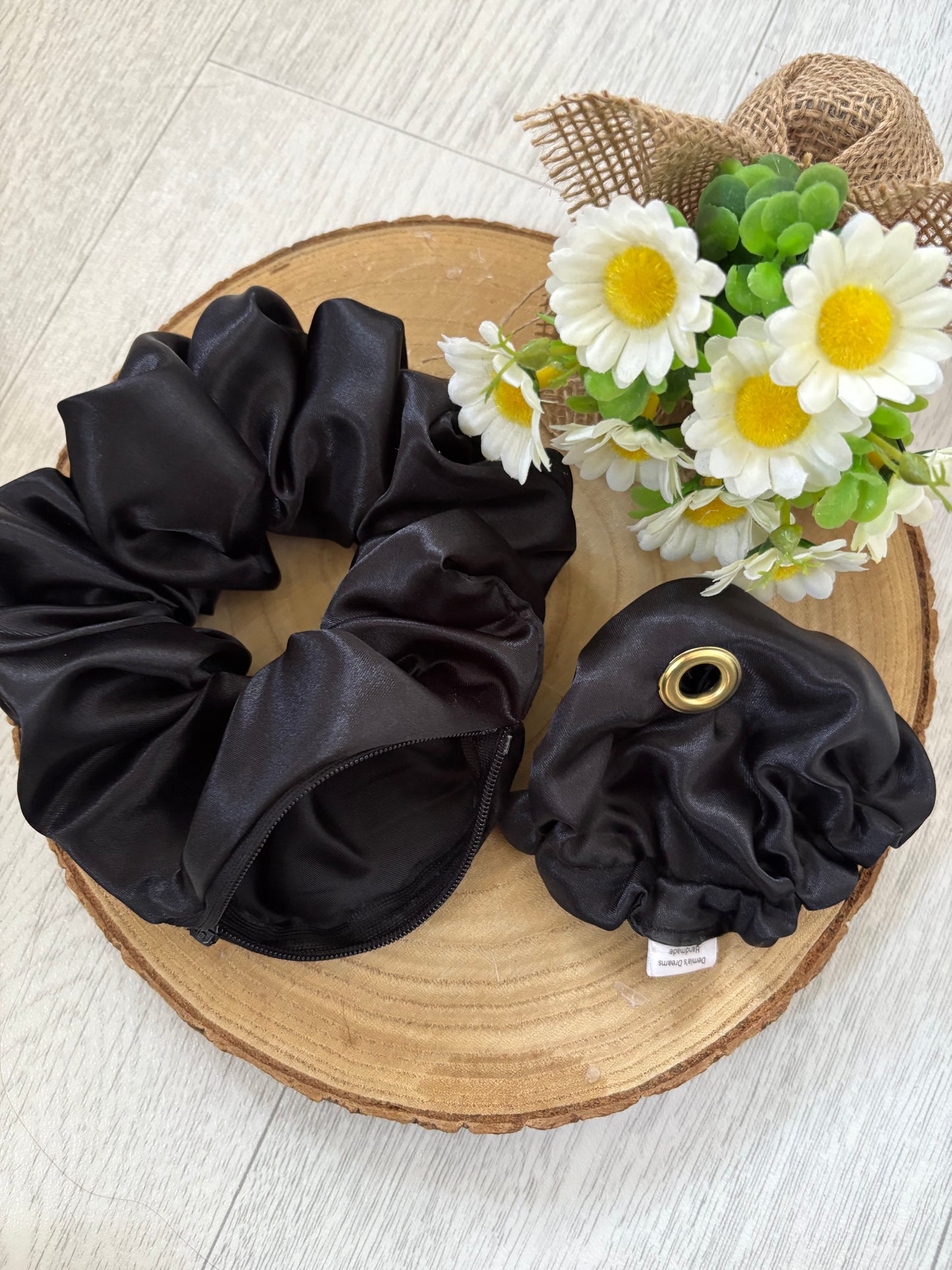 Large scrunchie with secret zipper and glass covering.